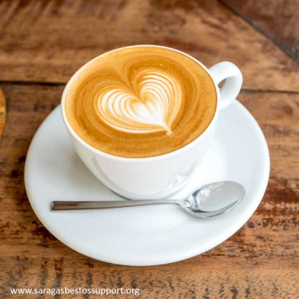 SARAG - Coffee Cup on a saucer with a teaspoon